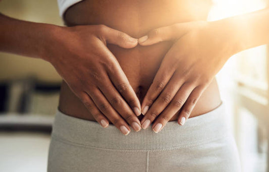 Woman holding her abdomen