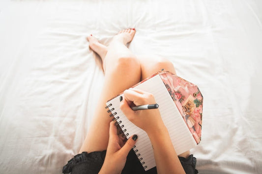 Person writing in journal