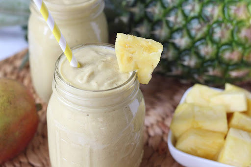 finished smoothie with pineapple garnish