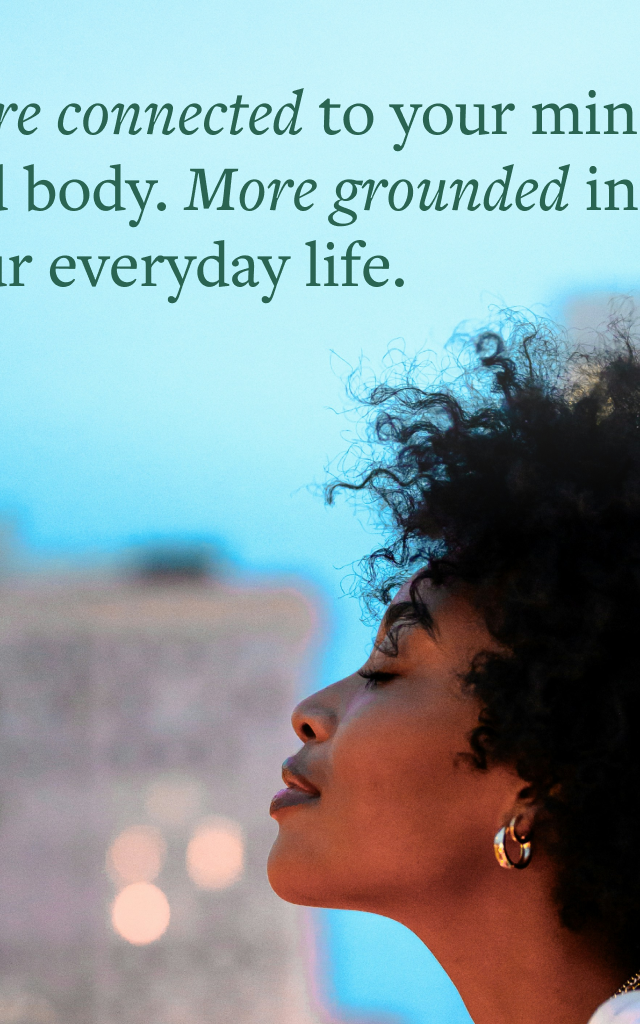 Woman's side profile against a city background with the text: "More connected to your mind and body. More grounded in your everyday life."