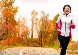 Person running outdoors in fall weather