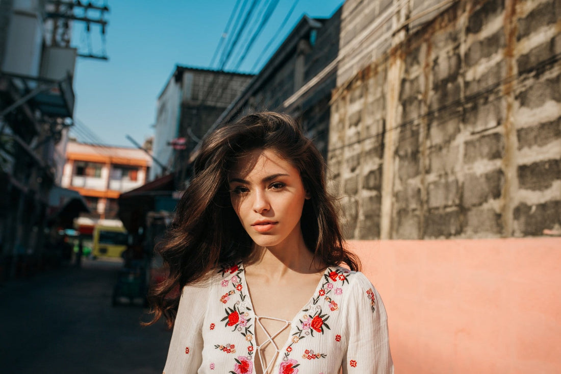 Woman with healthy skin walking around a city