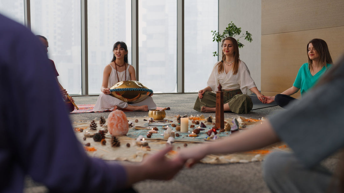 People sitting in a circle around crystals