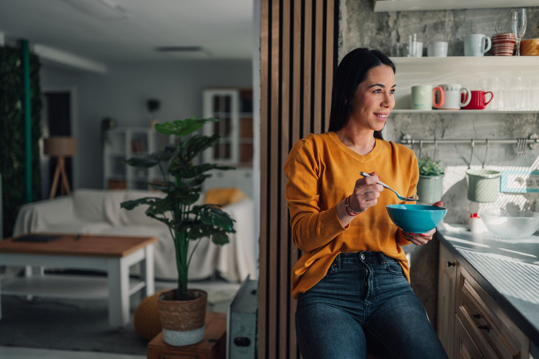 Woman eating from a bowl