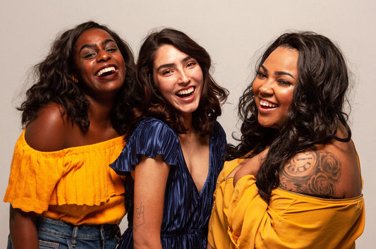 3 women laughing together