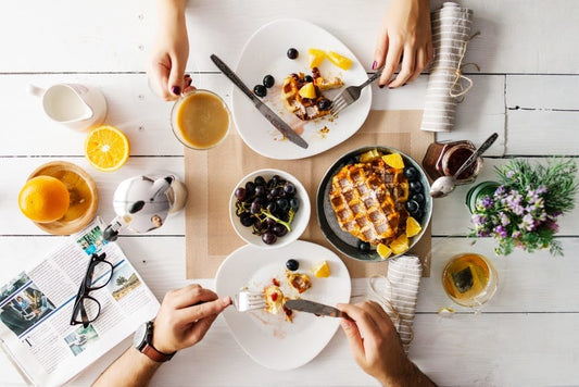 People eating breakfast at a table