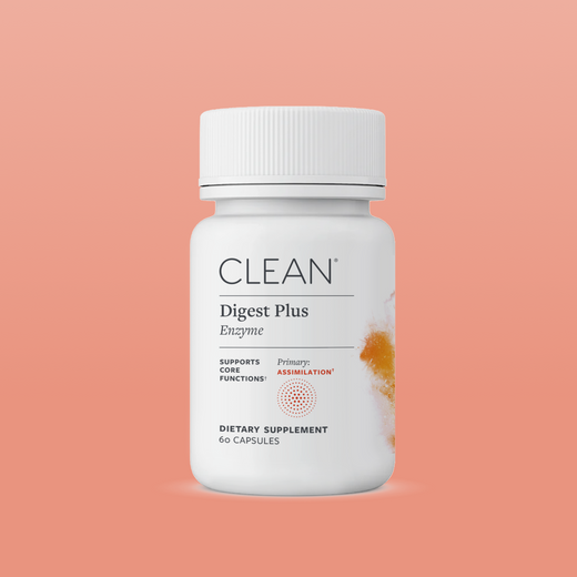 Supplement bottle labeled 'Clean Digest Plus' on a peach background