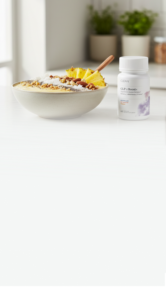 Bowl of cereal with fruit and a bottle of G&F Probiotics on a white surface.