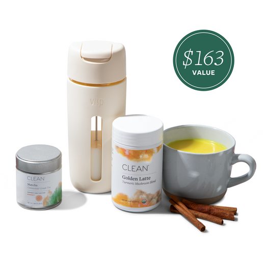 Tea-making set with a mug, bottles, and a container on a white background