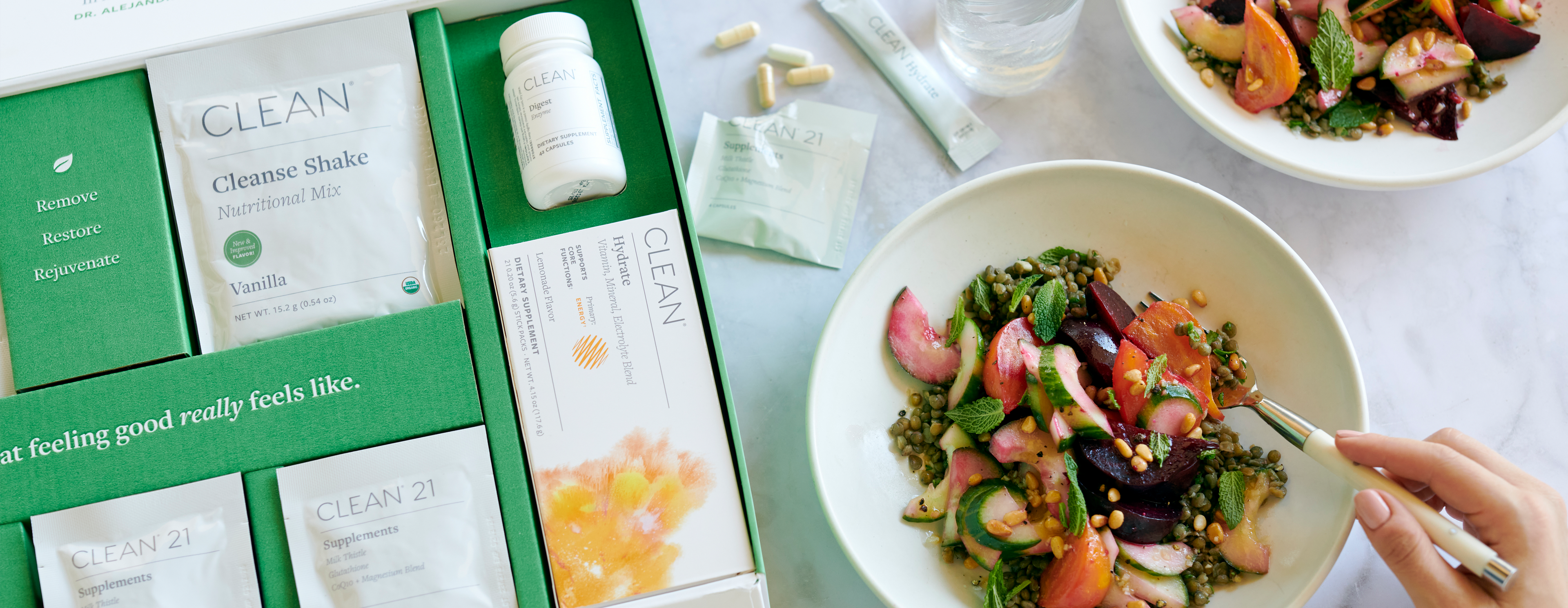 Clean 21 detox program box next to a colorful salad.